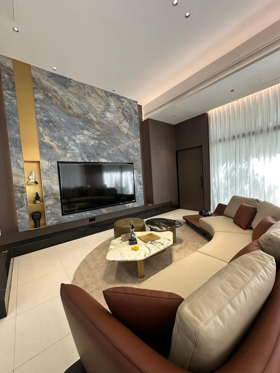 Finished living room with clean painted walls and feature panel